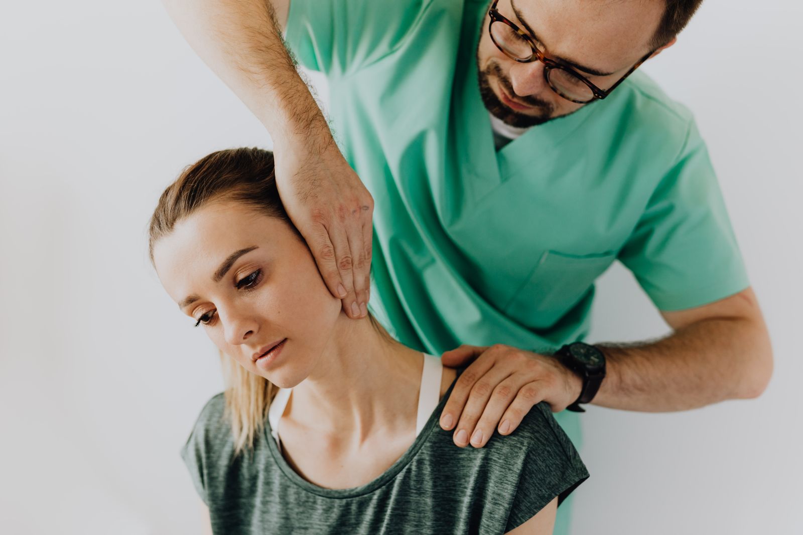 Physiotherapist treating a patient's neck pain